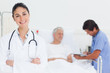 Doctor smiling while crossing her arms