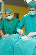 Surgeon opening a patient