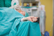 Unconscious patient with a tensiometer on his finger