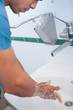 Surgeon washing his hands with soap