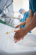 Surgeons washing their hands with masks 