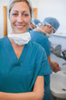 Smiling female surgeon with his arms folded