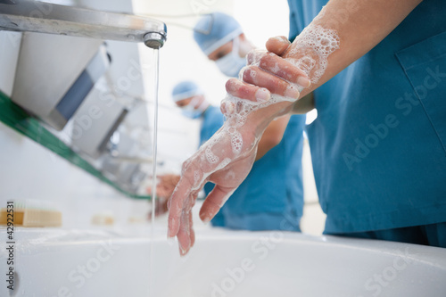 Photo: Surgeons in a hospital washing hands Surgeons in a hospital washing hands
