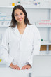 Pharmacist standing behind the counter of a pharmacist