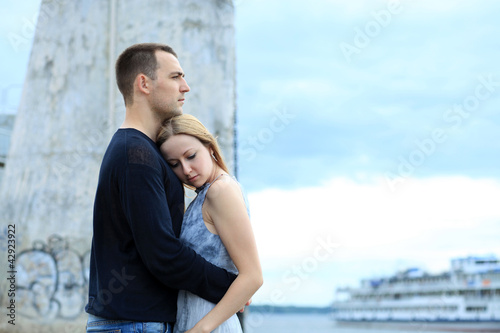 Photo: loving couple says goodbye to the river station loving couple says goodbye to the river station