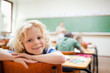 Elementary school student not paying attention to lesson