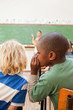 Back view of boys whispering during lesson