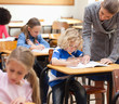 Teacher helping one of her students