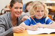 Student getting help from his teacher