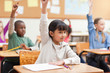 Little girl raising hand