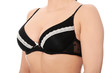 Photo: Full breasts of young woman in black bra Full breasts of young woman in black bra