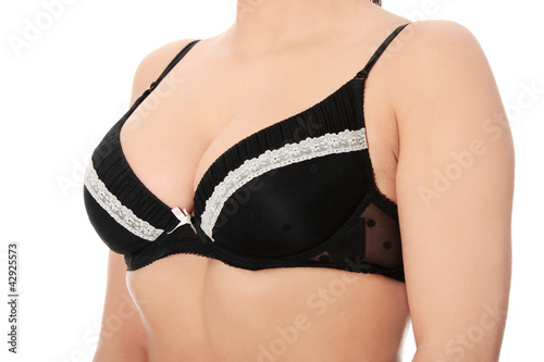 Photo: Full breasts of young woman in black bra Full breasts of young woman in black bra