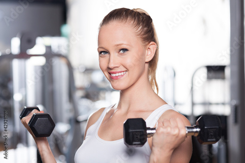 Photo: Woman lifting weights Woman lifting weights
