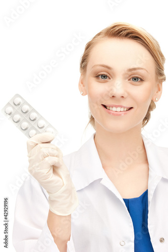 Photo: attractive female doctor with pills attractive female doctor with pills