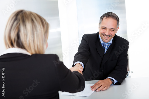 Photo: Businessman at the interview shaking hands Businessman at the interview shaking hands