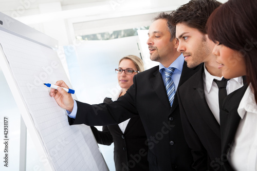 Photo: Group of business people at presentation Group of business people at presentation