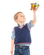 Foto: Cute little boy playing with a toy airplane Cute little boy playing with a toy airplane