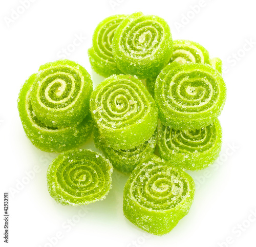 Photo: green jelly candies isolated on white. green jelly candies isolated on white.