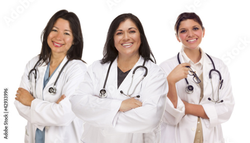 Photo: Three Hispanic Female Doctors or Nurses on White Three Hispanic Female Doctors or Nurses on White