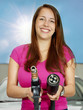 Foto: Woman holding variant types of gas pump nozzle outdoors Woman holding variant types of gas pump nozzle outdoors