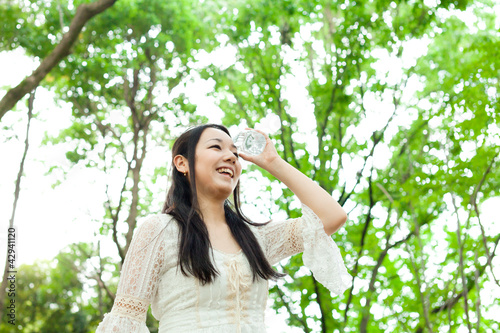 Photo: Beautiful young woman in the park Beautiful young woman in the park