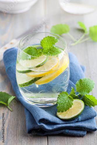 Photo: Glass of cold water with lime and lemon Glass of cold water with lime and lemon