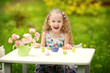 Photo: Beautiful girl playing in the spring garden Beautiful girl playing in the spring garden