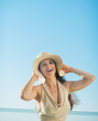 Photo: Portrait of happy woman on sea background Portrait of happy woman on sea background