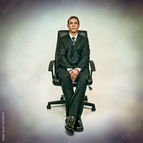 Photo: man in office chair man in office chair