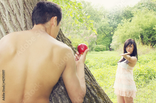 Photo: Adam holds apple Adam holds apple