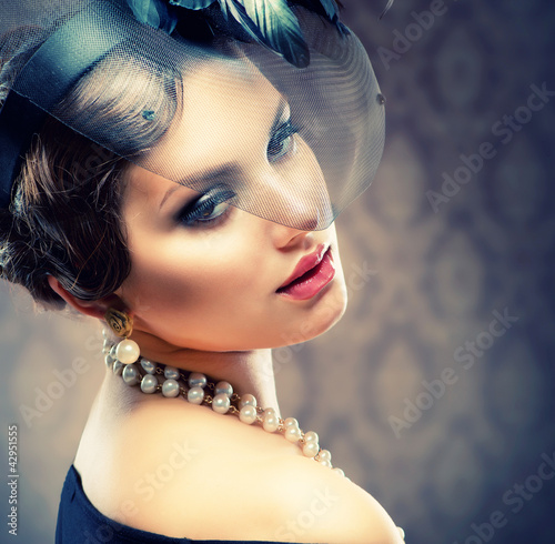 Photo: Retro Beauty Portrait. Vintage Styled. Beautiful Young Woman Retro Beauty Portrait. Vintage Styled. Beautiful Young Woman