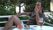 Video: man smokes on the terrace man smokes on the terrace