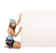 Woman in climbing equipment