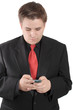 Photo: Young businessman messaging on cellphone Young businessman messaging on cellphone