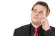 Photo: Young businessman in black formal suit talking on cellphone Young businessman in black formal suit talking on cellphone