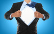 Photo: Businessman showing a superhero suit Businessman showing a superhero suit
