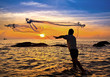 Photo: throwing fishing net during sunset , thai throwing fishing net during sunset , thai