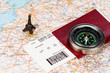 eiffel tower, compass and passport with boarding pass