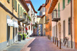 Old colorful street in Alba, Northern Italy.
