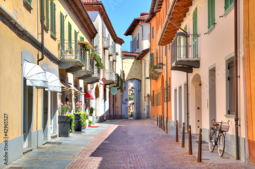 Photo: Old colorful street in Alba, Northern Italy. Old colorful street in Alba, Northern Italy.