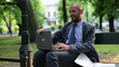 Businessman relaxing on the bench park