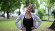 Portrait of smiling businesswoman in the city park