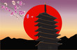 pagoda and pink floral branch at sunset