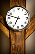 Foto: wall clock hanging on wooden construction wall clock hanging on wooden construction