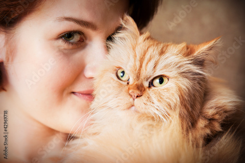 Photo: Young woman with Persian cat portrait Young woman with Persian cat portrait
