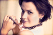 Young glamour lady with gold necklace