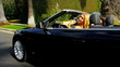 Pretty Girlfriends Enjoying Driving a Convertible