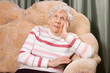 Portrait of the old woman on a sofa