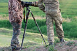 Camouflaged wildlife photographers motion blurred