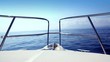 Boating in blue ocean sea view from boat bow deck